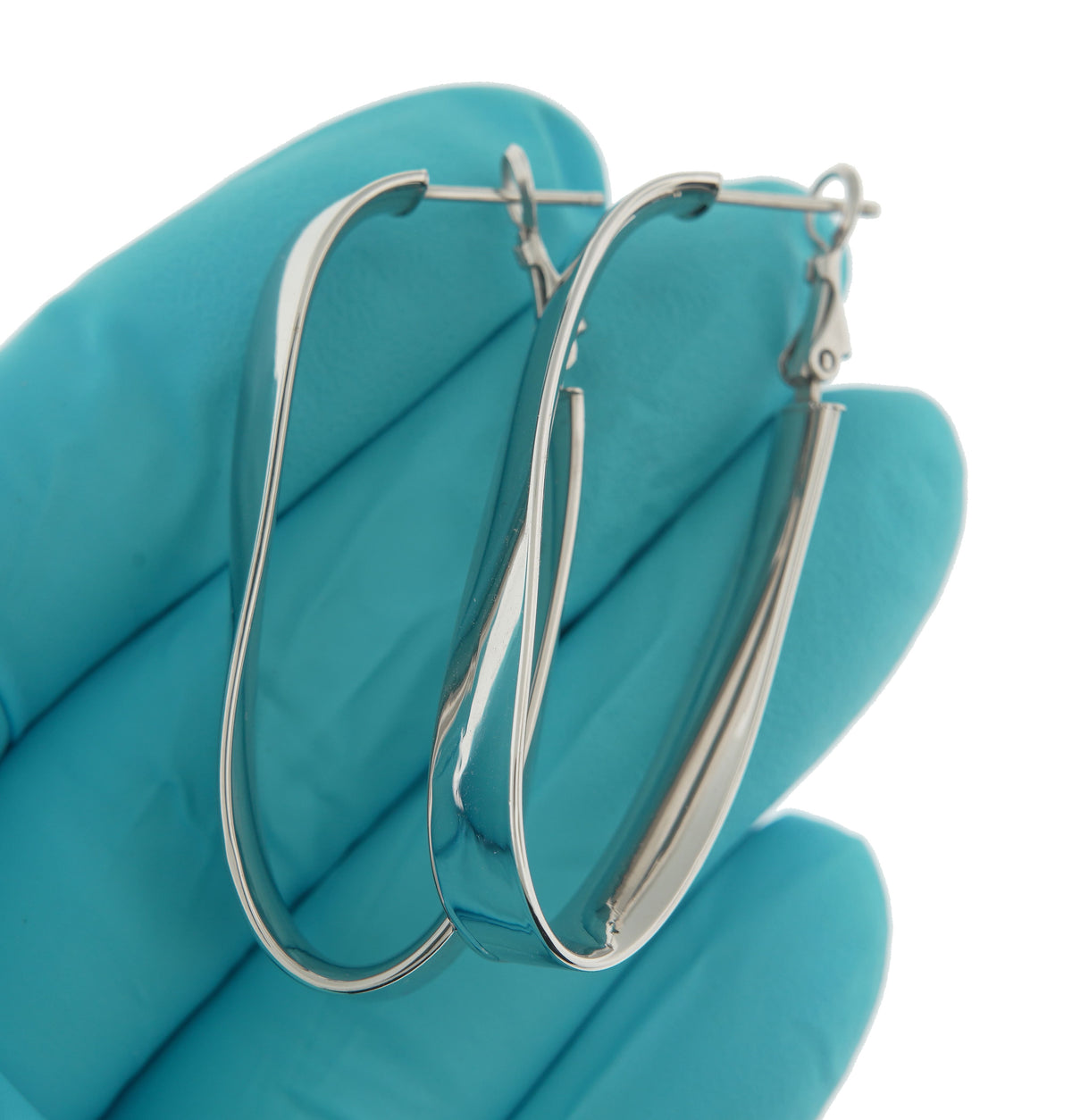 14k white gold twisted oval omega back hoop earrings 43mm x 19mm x 7mm
