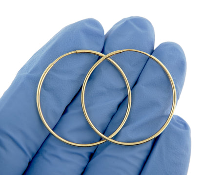 14k yellow gold round endless hoop earrings 27mm x 1.25mm