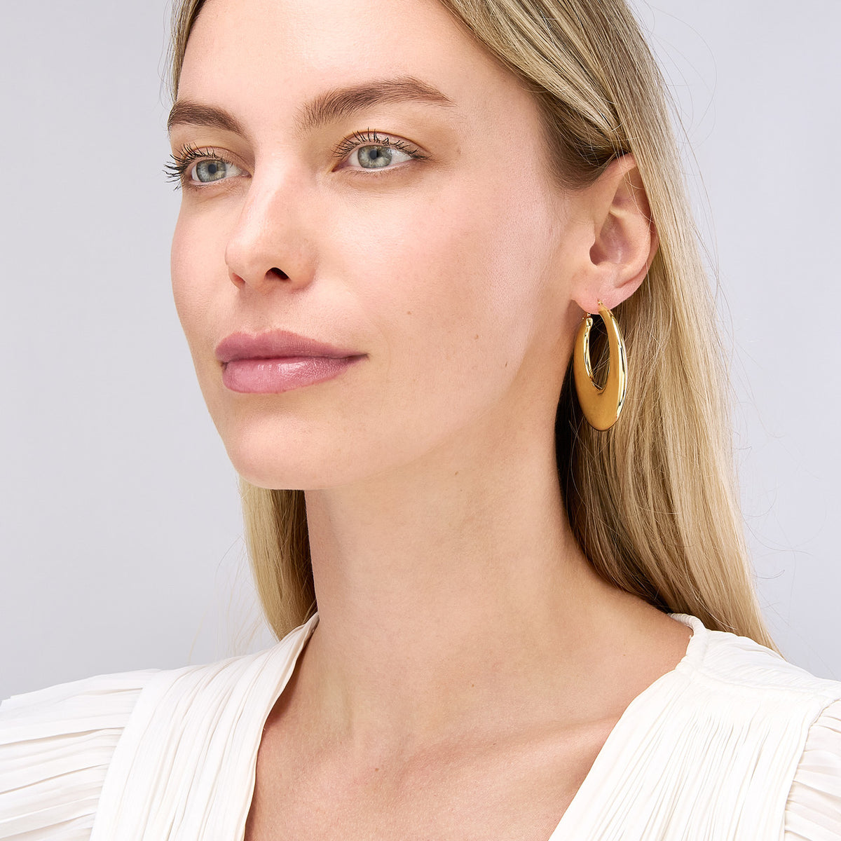 14k yellow gold large graduated round puffed hoop earrings