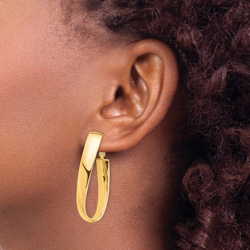 14k yellow gold twisted oval omega back hoop earrings 43mm x 19mm x 7mm