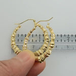 Load and play video in Gallery viewer, 14K Yellow Gold Bamboo Hoop Earrings 33mm
